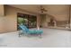 Relaxing patio area with chaise lounge and views of glass doors to interior at 11821 S Tuzigoot Ct, Phoenix, AZ 85044