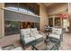 Comfortable outdoor patio with plush seating and views of lush foliage at 11821 S Tuzigoot Ct, Phoenix, AZ 85044