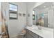 Bathroom featuring a single sink vanity and a shower/tub combo with neutral walls and colors at 12374 W Locust Ln, Avondale, AZ 85323