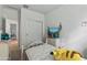 This bedroom features neutral walls, carpet, and built in closet with TV and dresser at 12374 W Locust Ln, Avondale, AZ 85323