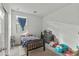 A bedroom is shown with a bed, dresser, and ' toy cars at 12374 W Locust Ln, Avondale, AZ 85323