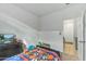 The bedroom features a bed with an orange and blue blanket at 12374 W Locust Ln, Avondale, AZ 85323
