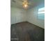 This bedroom features neutral walls and carpet, with windows offering natural light at 12374 W Locust Ln, Avondale, AZ 85323
