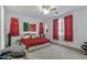 A spacious bedroom features a large bed and three windows at 12374 W Locust Ln, Avondale, AZ 85323