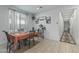 Cozy dining area features natural light, neutral tones, and a quaint setting for meals and gatherings at 12374 W Locust Ln, Avondale, AZ 85323