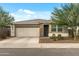 Charming single-story home with a well-maintained front yard and a two-car garage at 12374 W Locust Ln, Avondale, AZ 85323