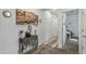 Bright hallway with neutral carpet and decorative accents on the wall at 12374 W Locust Ln, Avondale, AZ 85323