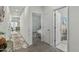 Bright hallway with neutral carpet and multiple doors leading to bedrooms and bathrooms at 12374 W Locust Ln, Avondale, AZ 85323