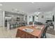 Open kitchen with granite island and dining area creating seamless flow throughout the living space, perfect for entertaining at 12374 W Locust Ln, Avondale, AZ 85323