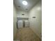 Laundry room featuring tile floors and both a washer and dryer at 12374 W Locust Ln, Avondale, AZ 85323