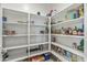 Well-organized pantry with ample shelving, providing an abundance of storage space for kitchen essentials at 12374 W Locust Ln, Avondale, AZ 85323