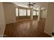 Bedroom has lots of light with an updated ceiling fan and mirrored closets at 12425 W Willow Ave, El Mirage, AZ 85335