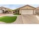 Charming single-story home with a two-car garage and desert landscaping for low maintenance at 12425 W Willow Ave, El Mirage, AZ 85335