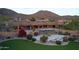This home has a pool, spa, turf, and patio with an outdoor fireplace at 12711 N 117Th St, Scottsdale, AZ 85259
