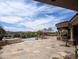 Luxury backyard features a pool with a stone patio, covered porch, and mountain views at 12711 N 117Th St, Scottsdale, AZ 85259