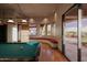 Game room with a billiard table, custom lighting, and a large sliding glass door offering stunning desert views at 12711 N 117Th St, Scottsdale, AZ 85259
