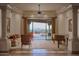 Open living room with expansive views, decorative columns, and tile flooring at 12711 N 117Th St, Scottsdale, AZ 85259