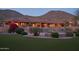 Spacious home exterior with a lush lawn, pool, and meticulously landscaped grounds at 12711 N 117Th St, Scottsdale, AZ 85259