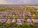 Scenic aerial shot highlighting neighborhood's layout and well-manicured lawns at 14095 W Larkspur Dr, Surprise, AZ 85379