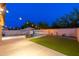 Private backyard featuring a pool, lounge chairs, lush green lawn, and ambient string lighting at 14095 W Larkspur Dr, Surprise, AZ 85379