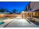 Serene backyard featuring a pool, patio, and comfortable seating, perfect for outdoor living at 14095 W Larkspur Dr, Surprise, AZ 85379