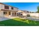 Backyard has a well-maintained pool, lounge chairs, an outdoor grill and features desert landscaping at 14095 W Larkspur Dr, Surprise, AZ 85379