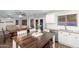 Spacious kitchen with a large island, stainless steel appliances, and adjacent dining area at 14095 W Larkspur Dr, Surprise, AZ 85379
