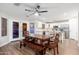 The modern kitchen and dining area feature stainless steel appliances and sleek cabinetry at 14095 W Larkspur Dr, Surprise, AZ 85379