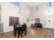 Inviting living room and dining area with a high ceiling and natural light at 14095 W Larkspur Dr, Surprise, AZ 85379