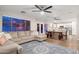 Open-concept living room, dining area, and kitchen for modern living and entertaining at 14095 W Larkspur Dr, Surprise, AZ 85379