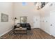 Cozy living room featuring high ceilings, wood-look floors, and stylish decor at 14095 W Larkspur Dr, Surprise, AZ 85379