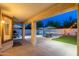 Covered patio area overlooking a refreshing pool, lounge chairs, and outdoor dining space at 14095 W Larkspur Dr, Surprise, AZ 85379