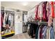 Spacious walk-in closet with ample storage, shelving, and hanging space for clothing and accessories at 14095 W Larkspur Dr, Surprise, AZ 85379