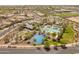 Beautiful aerial view of a Primary-planned community featuring a pool, basketball court, and lush green spaces at 14166 W Valentine St, Surprise, AZ 85379