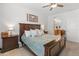 Comfortable bedroom featuring a king bed, ceiling fan, and artwork, creating a cozy retreat at 14166 W Valentine St, Surprise, AZ 85379