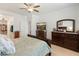 Primary bedroom features a king bed, ceiling fan, and ample storage, creating a private oasis at 14166 W Valentine St, Surprise, AZ 85379
