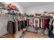 Spacious walk-in closet providing ample storage with shelving and clothes racks at 14166 W Valentine St, Surprise, AZ 85379