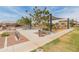A Gathering-friendly park with playground, seating, bike rack and shaded play area in a well-maintained community at 14166 W Valentine St, Surprise, AZ 85379