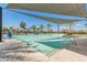 Relaxing community pool with clear water and shaded seating areas for residents to enjoy at 14166 W Valentine St, Surprise, AZ 85379