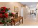 Inviting hallway with console table, stylish decor, and view into the living spaces at 14166 W Valentine St, Surprise, AZ 85379