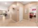 Spacious hallway leading to dining area and bedroom, showcasing easy navigation and access at 14166 W Valentine St, Surprise, AZ 85379
