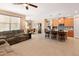 Open living area showcases seamless flow with kitchen, dining area, and comfortable seating at 14166 W Valentine St, Surprise, AZ 85379