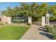 Grand entrance to Marley Park with stone pillars, wrought iron gates, and lush green lawn at 14166 W Valentine St, Surprise, AZ 85379