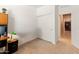 Well-lit office area featuring closet with slider doors and a view into the hallway at 14166 W Valentine St, Surprise, AZ 85379
