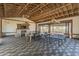 Versatile outdoor event space with dining tables, ping pong tables, and a cozy fireplace at 14166 W Valentine St, Surprise, AZ 85379