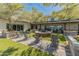 Inviting outdoor area with a fire pit, comfortable seating, and ambient lighting for evening gatherings at 14166 W Valentine St, Surprise, AZ 85379