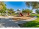 Fun playground area with slides, climbing structures, and a soft wood chip ground cover at 14166 W Valentine St, Surprise, AZ 85379