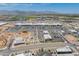 Aerial view of a retail shopping center including dining and shopping options with mountain views at 14166 W Valentine St, Surprise, AZ 85379