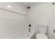This bathroom features white subway tile, a shower head, and a toilet at 16402 N 31St St # 232, Phoenix, AZ 85032
