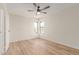 This bright bedroom features wood-look floors and two windows at 16402 N 31St St # 232, Phoenix, AZ 85032